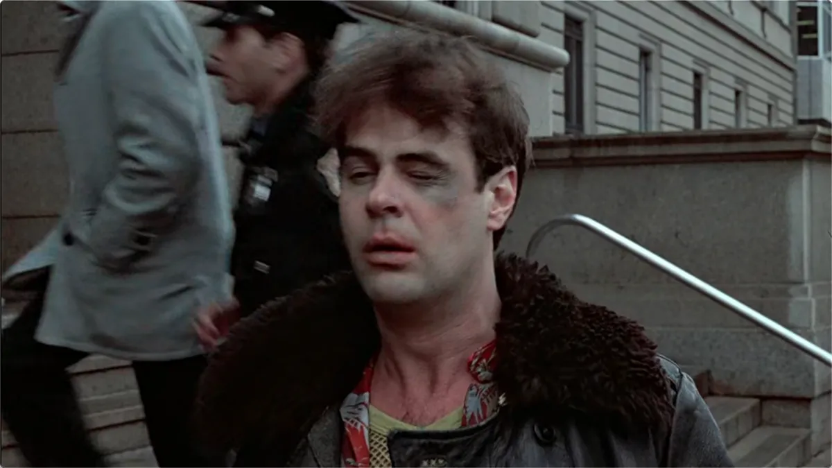 A still frame from the film Trading Places in which Dan Akyroyd has been beaten up.