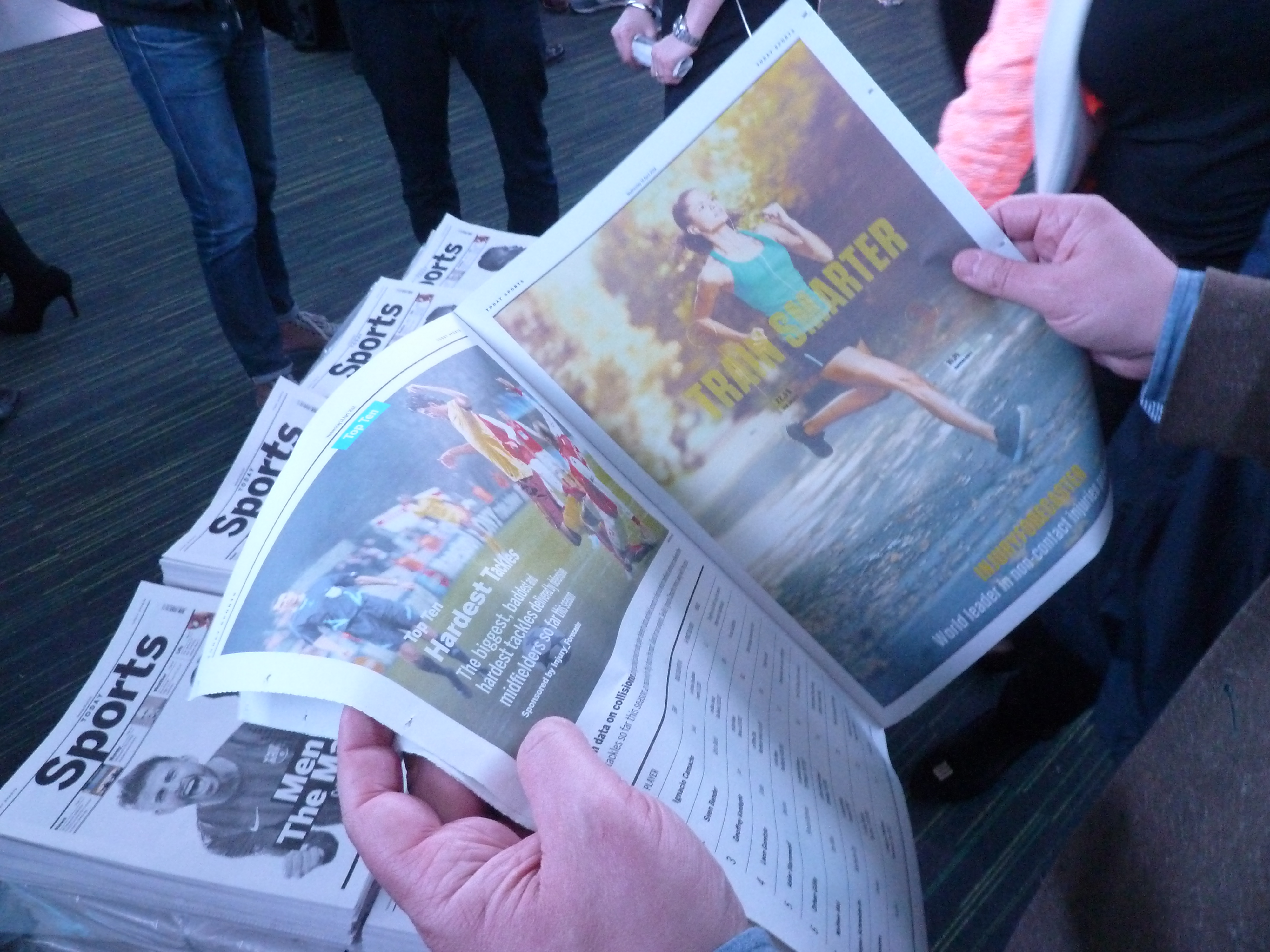 Winning Formula a Design Fiction newspaper from the future in the hands of some construction workers