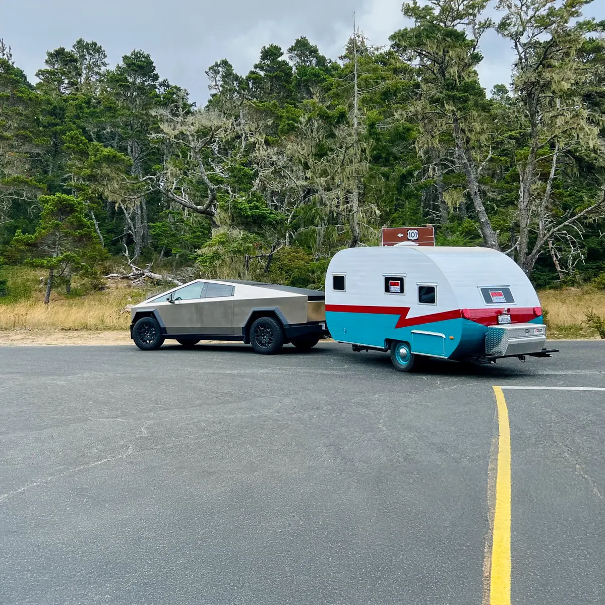 Imagination Unlocks Greatness An Image of a Tesla Cybertruck hitched to a 1960s style retro camper