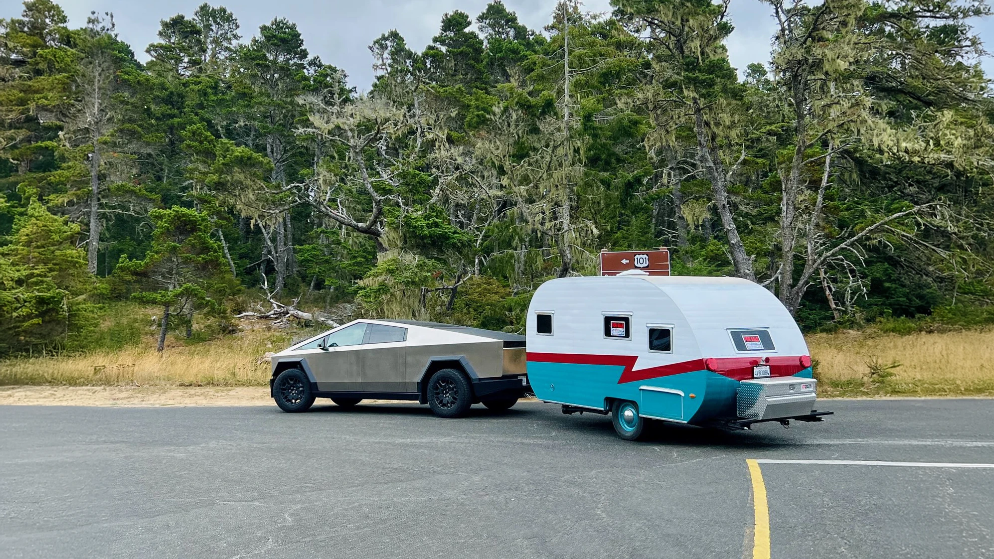 Imagination Unlocks Greatness An Image of a Tesla Cybertruck hitched to a 1960s style retro camper